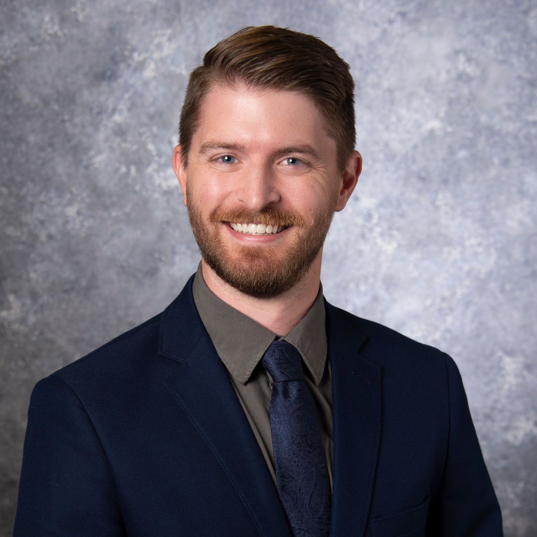 Professional headshot of Rhett Swarb
