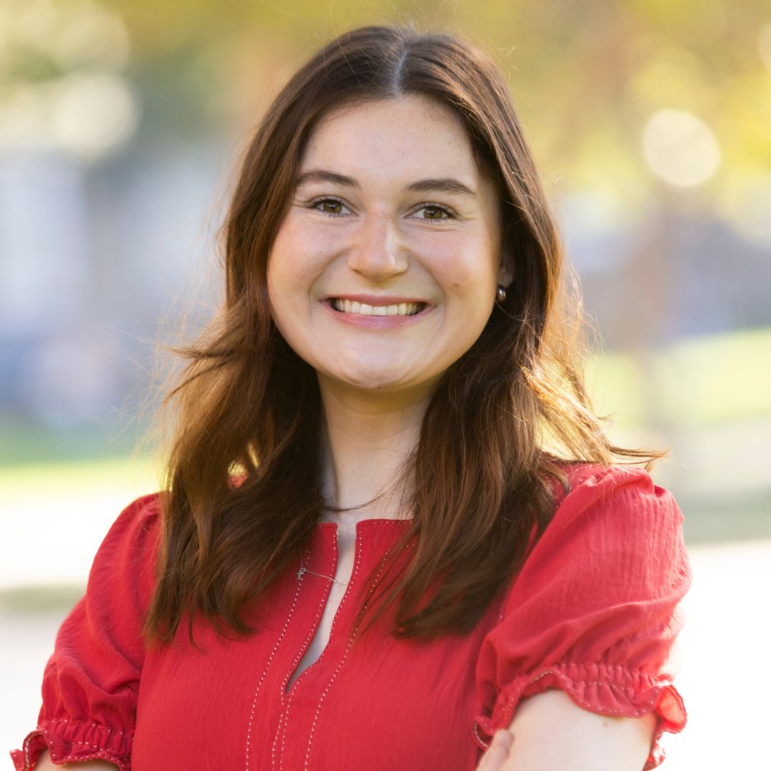 Photo of Kara Vita wearing a red dress