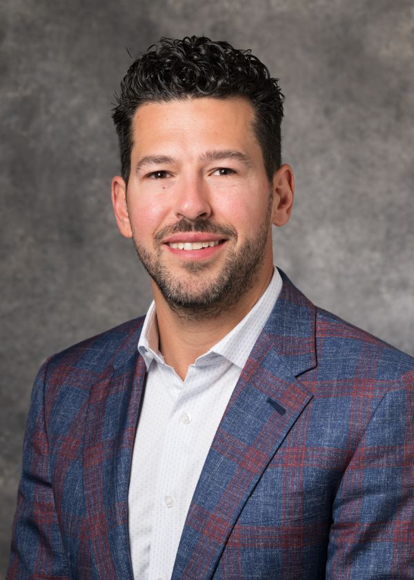 Formal headshot of Munear Kuzbari