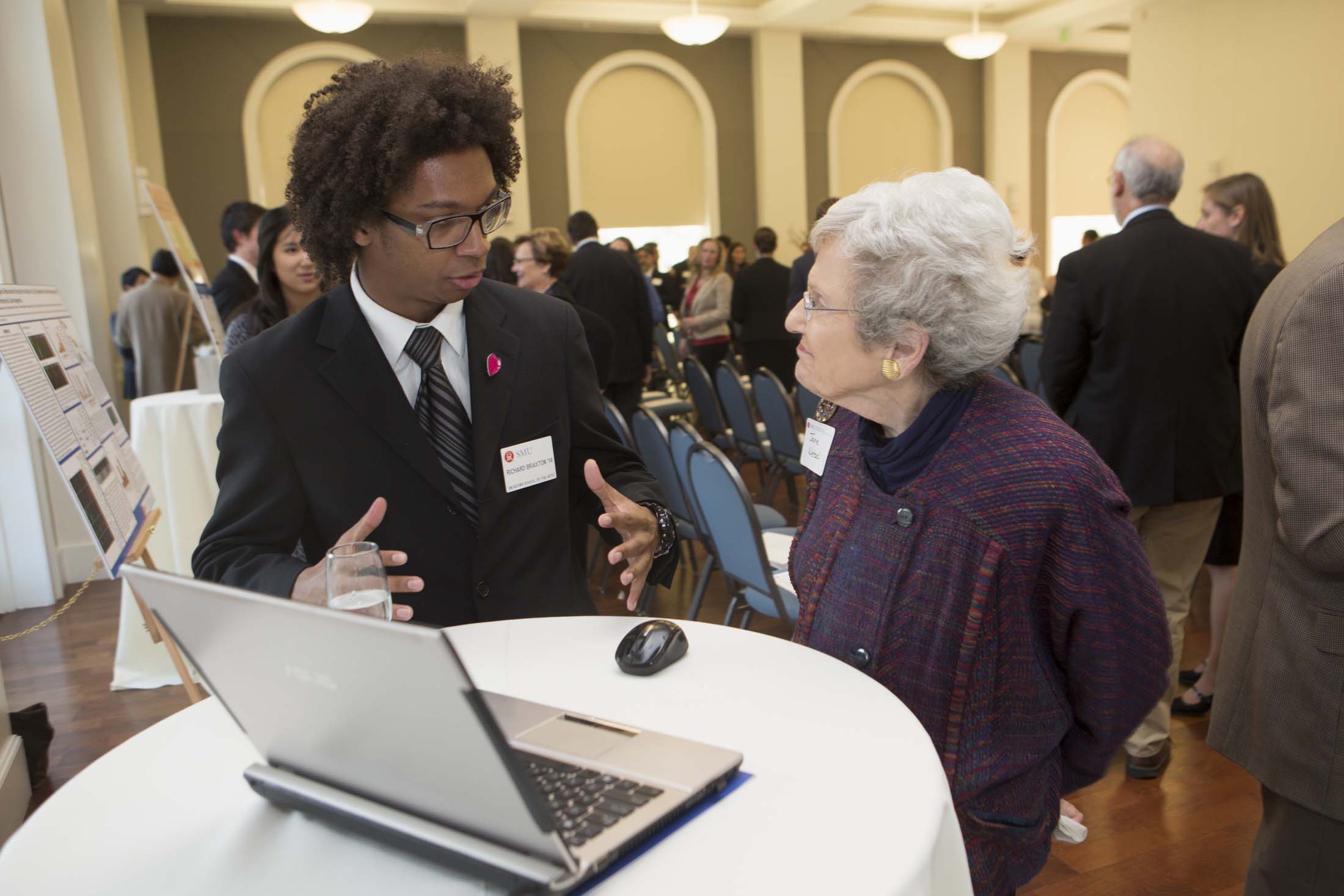 student presenting research at event