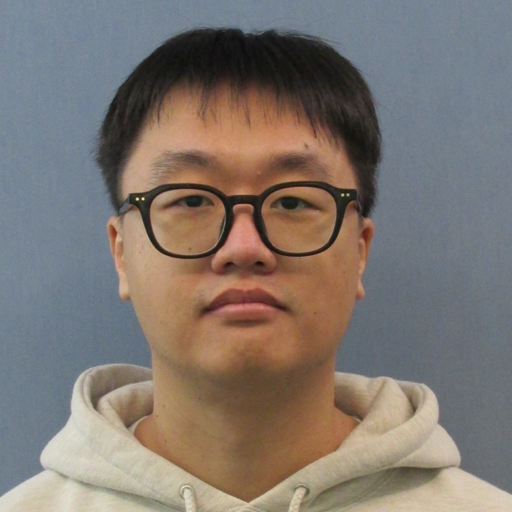Picture of Allen Cho wearing black rimmed glasses and hoodie