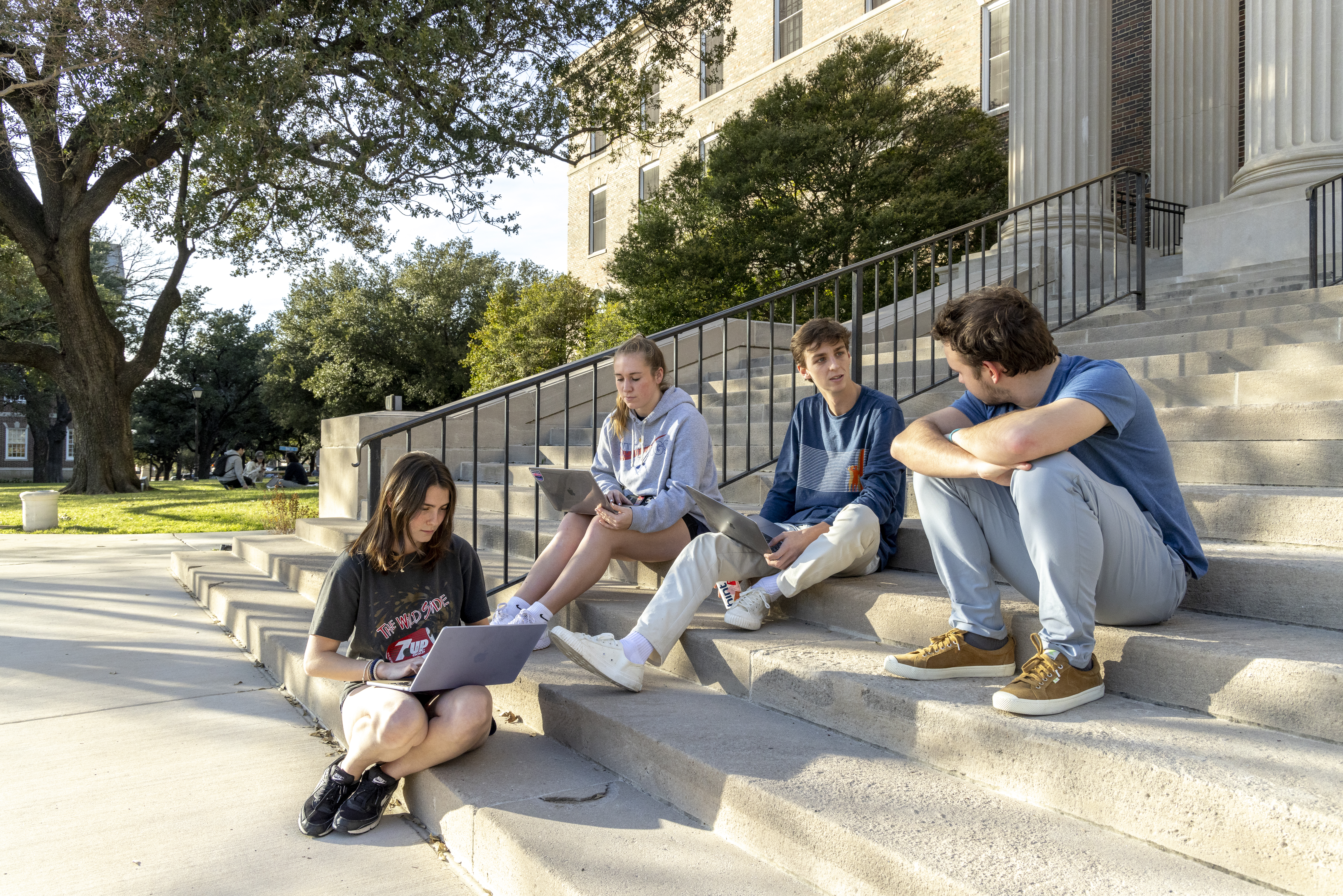 students studying on steps