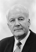 Black and white photo of suited man