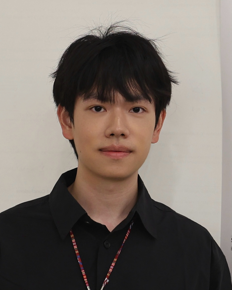 Portrait of PhD candidate Zixi Zhang wearing a black collard shirt