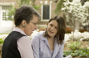 professor and student talking outside