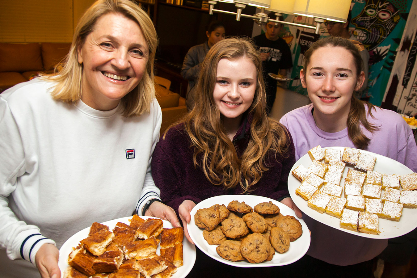 faculty and students with cookies