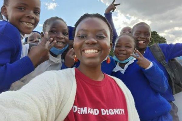student with group of children