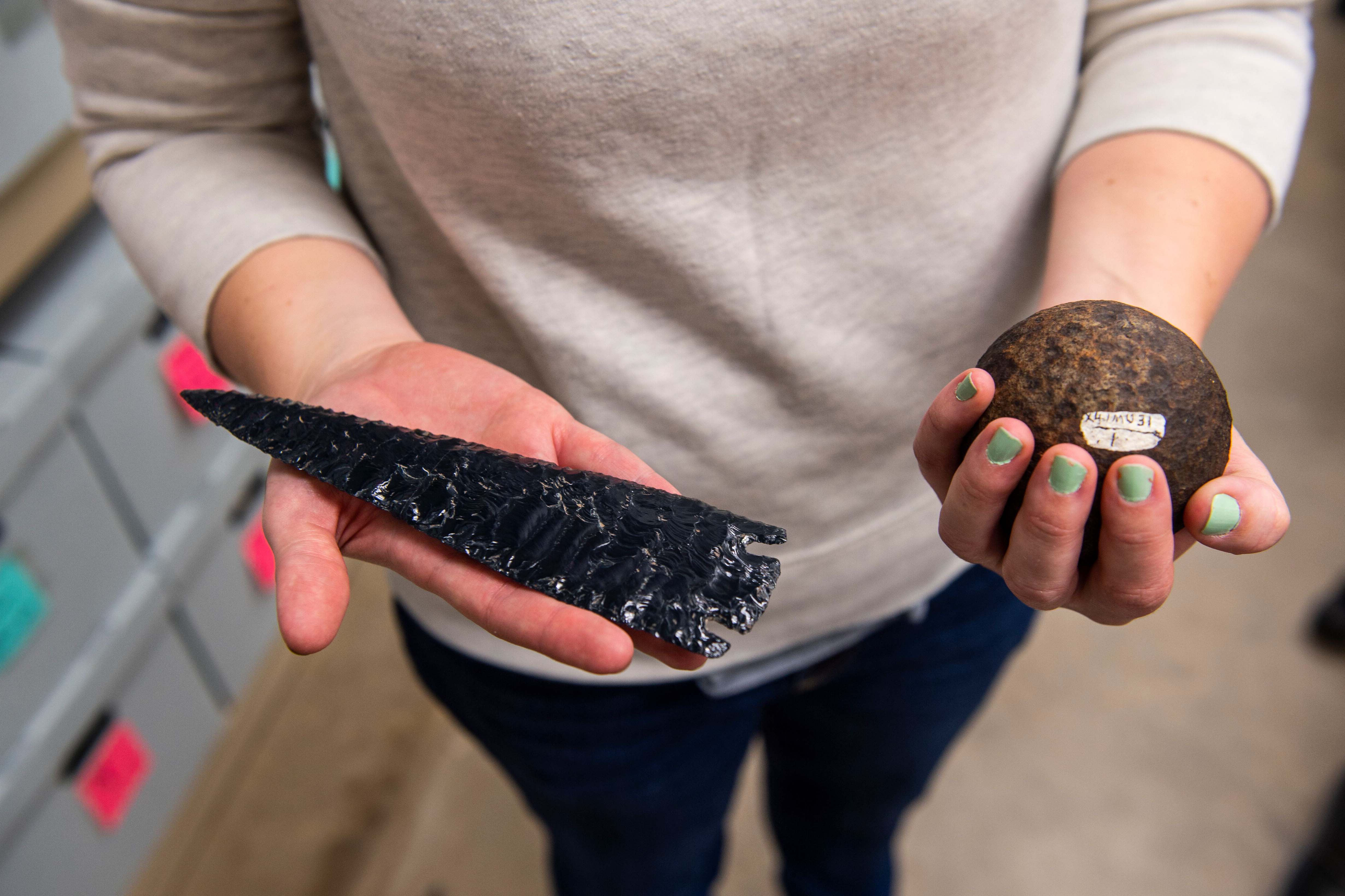 student with fossils