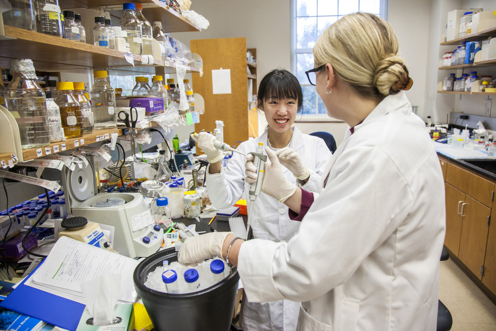 student and teacher in lab