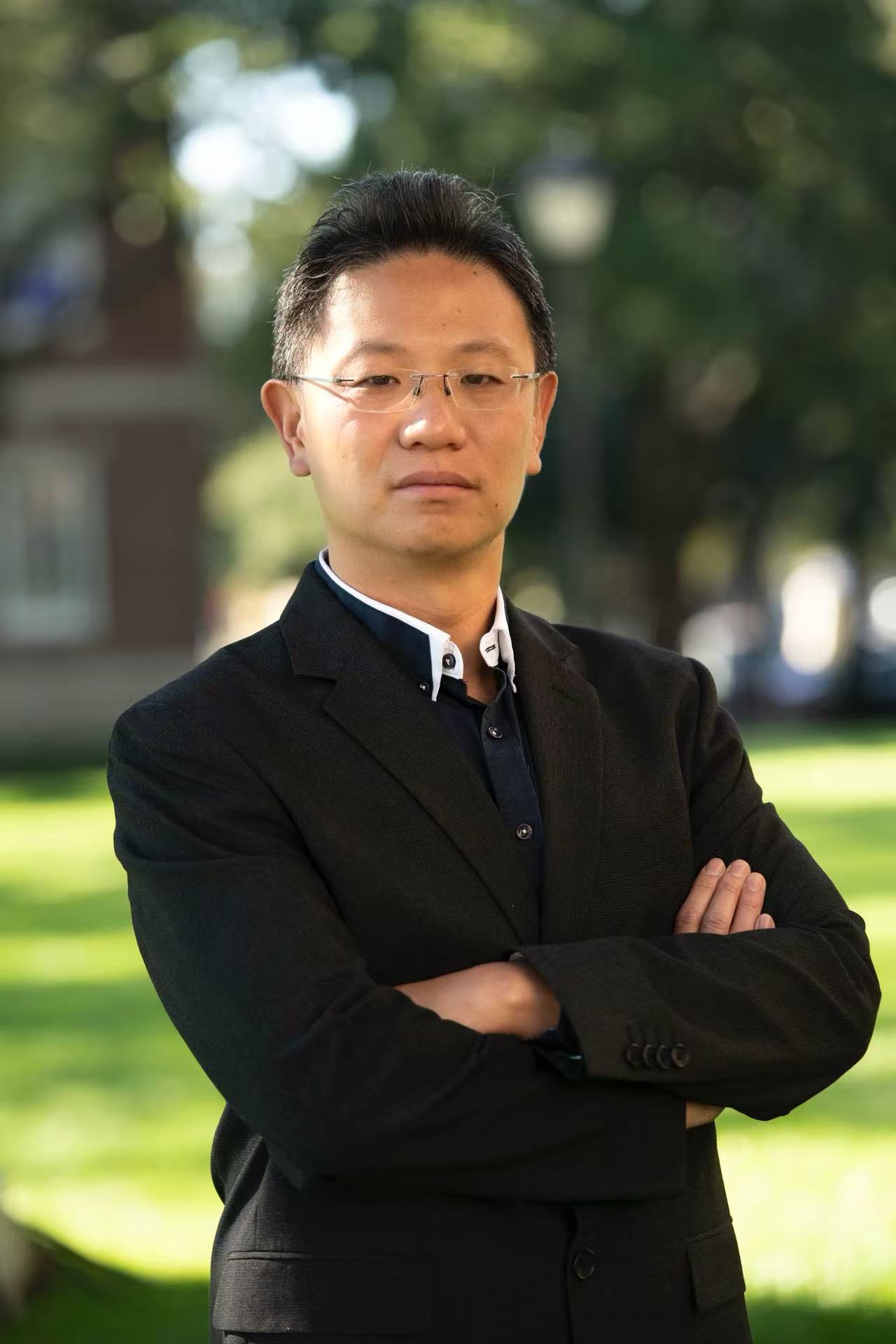 Photo of Zhihao Wun wearing a black suite jacket