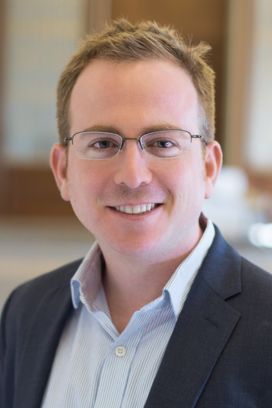 Fernando Leibovici wearing glasses and blue sport coat