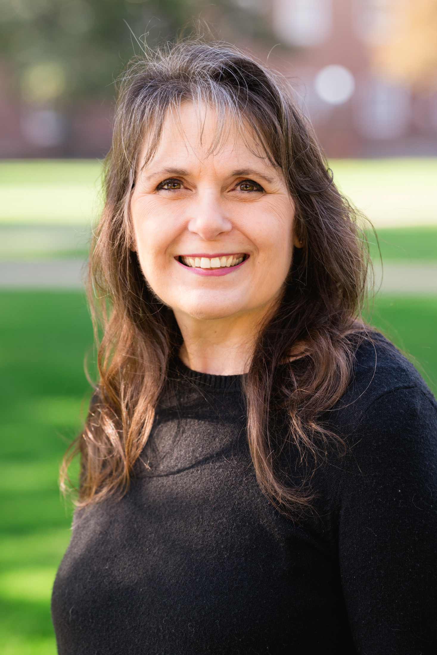 Photo of Margi Evans in a black long sleeve shirt