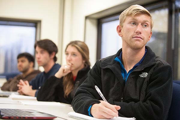 student writing in class