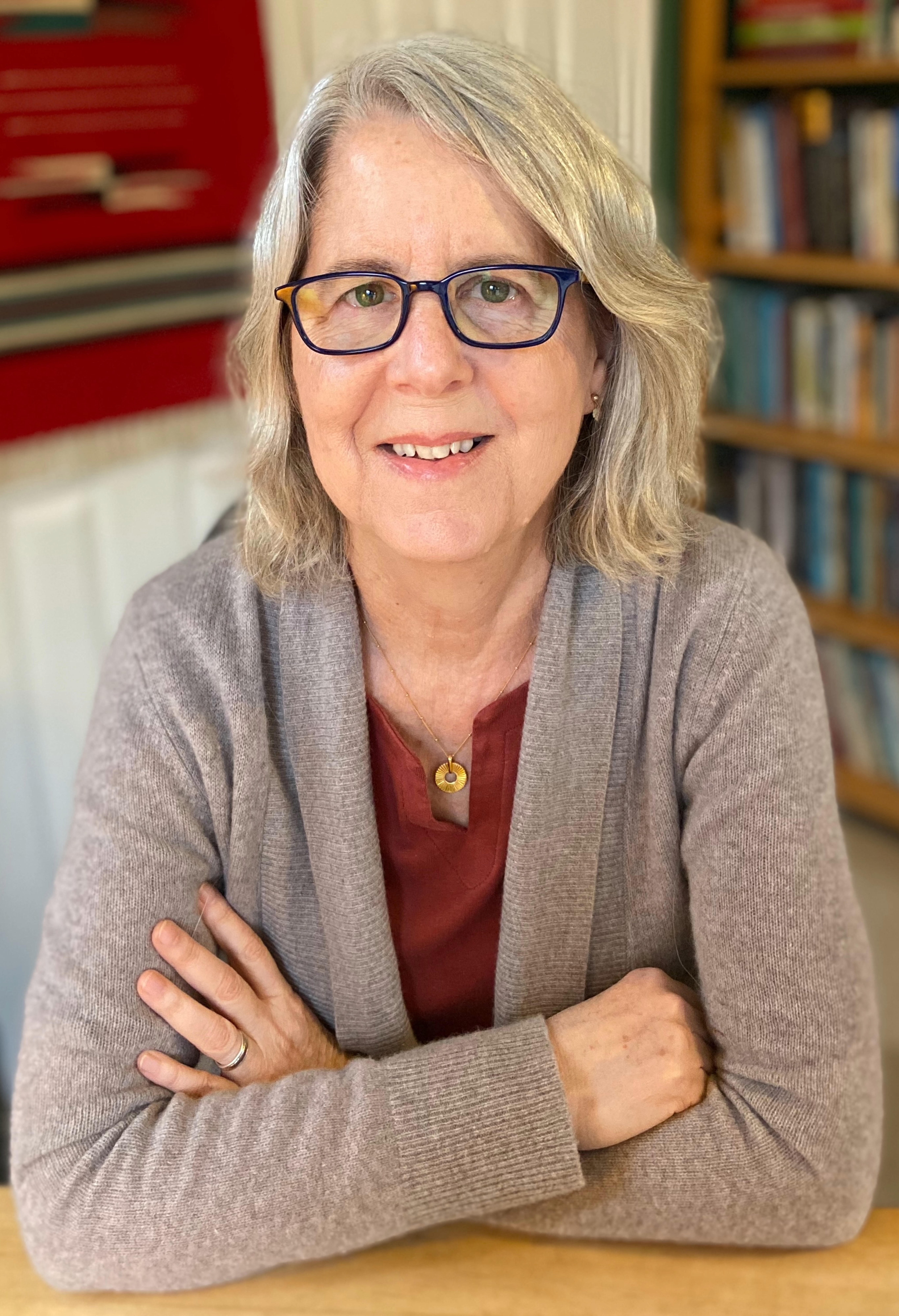 Photo of professor Jean Kazez seated with arms crossed