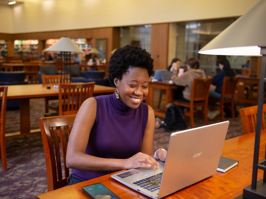 student in library studying