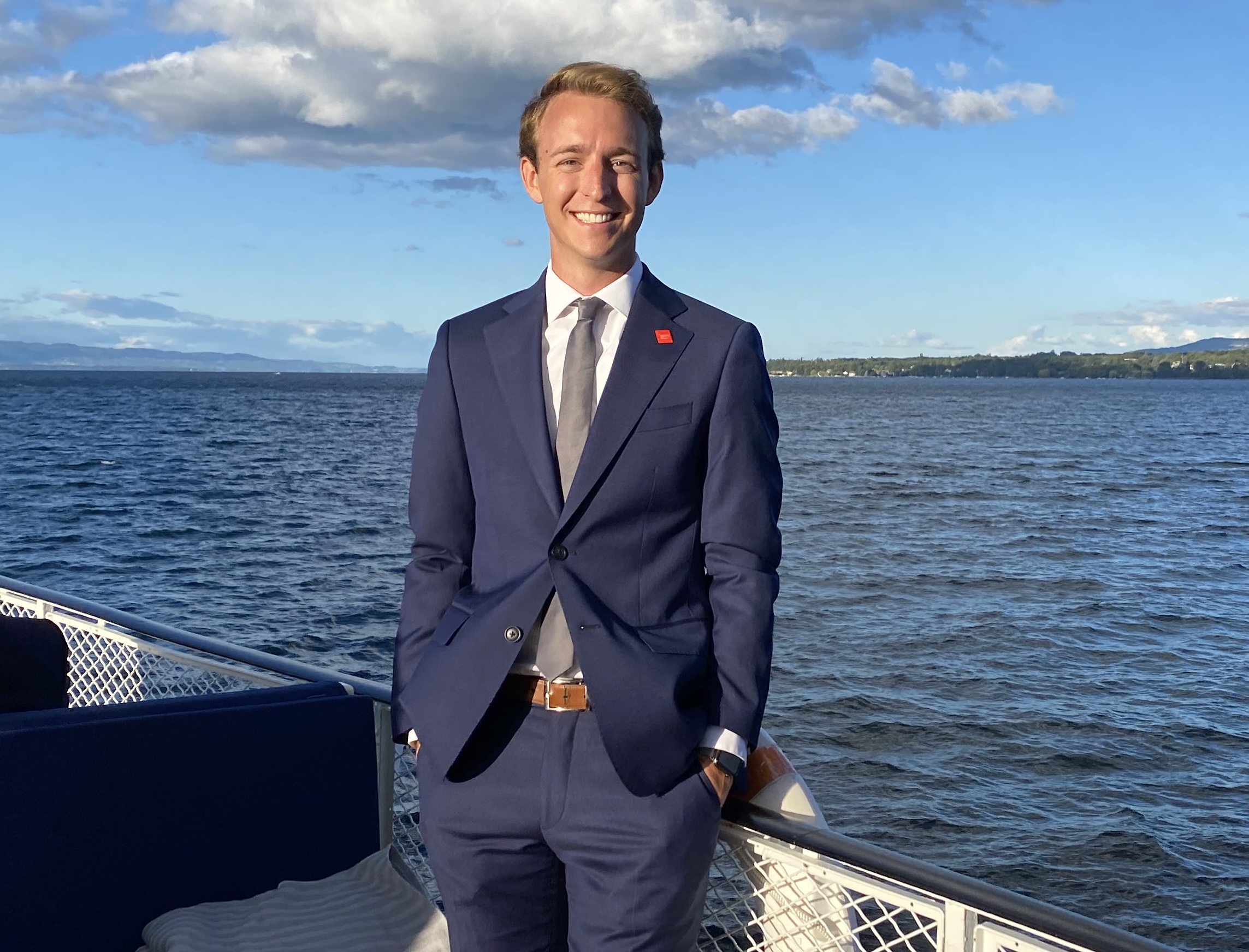 SMU Bachelor of Arts in human rights graduate Peter Wetherbee poses on the deck of a boat.