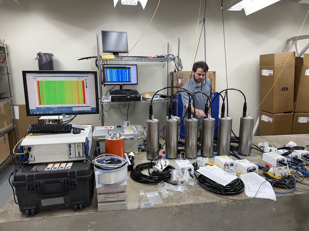 A graduate student in SMU's Earth Sciences department works with specialized equipment in the Seismoacoustic Research Lab.