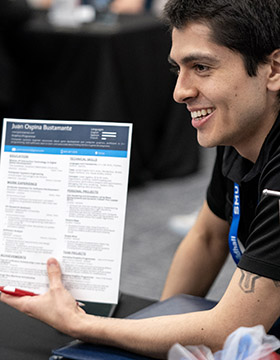 SMU Guildhall student smiles at Career Fair