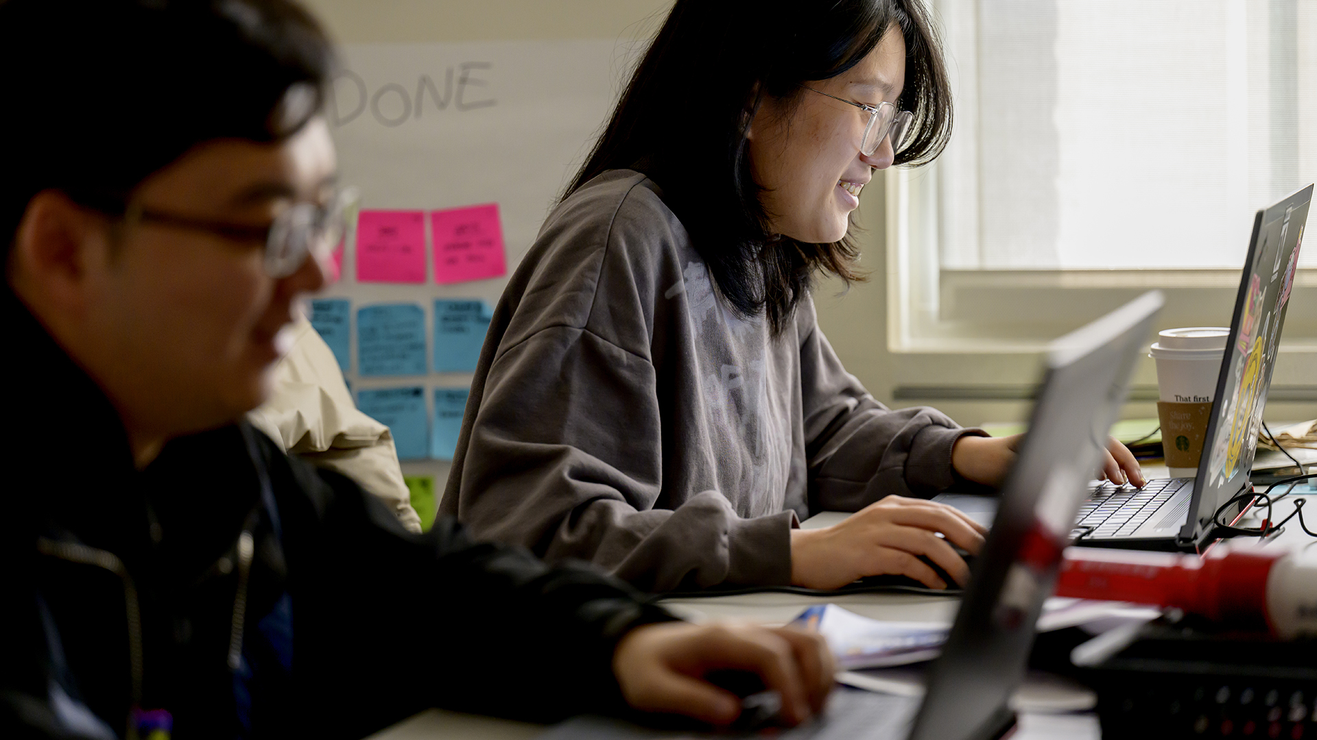 Photo of SMU Guildhall students working at computers