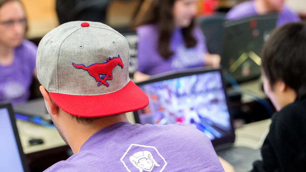 SMU Guildhall student with Peruna hat