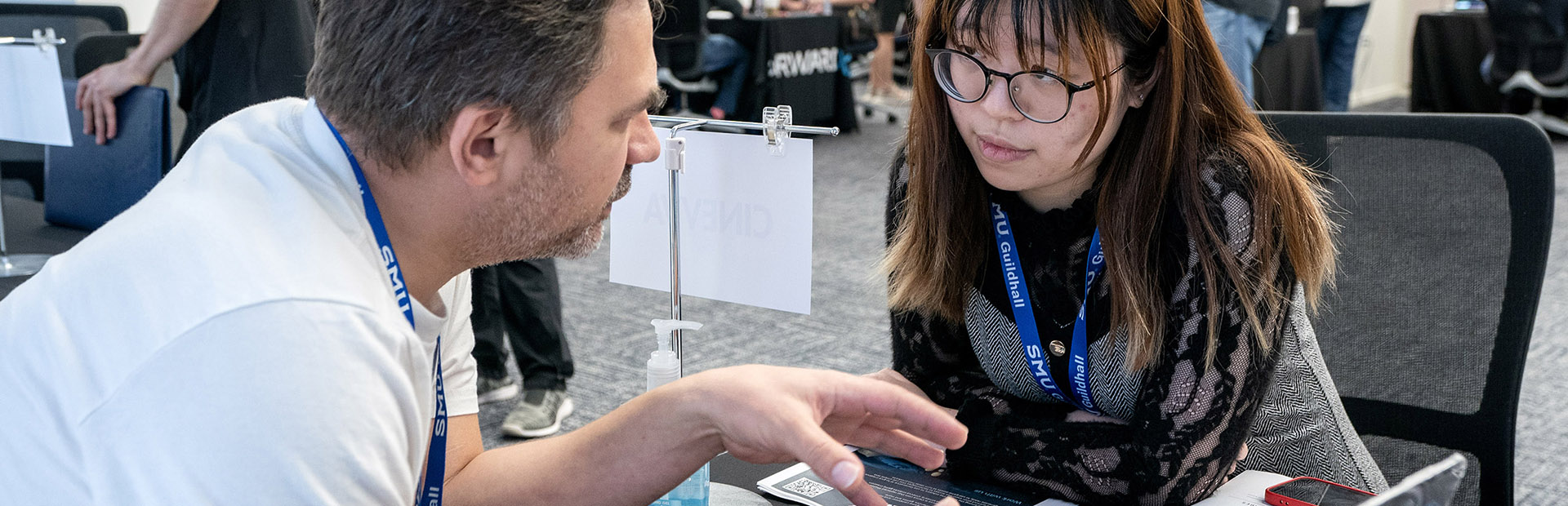 Photo of industry interviewing a SMU Guildhall student during Career Fair