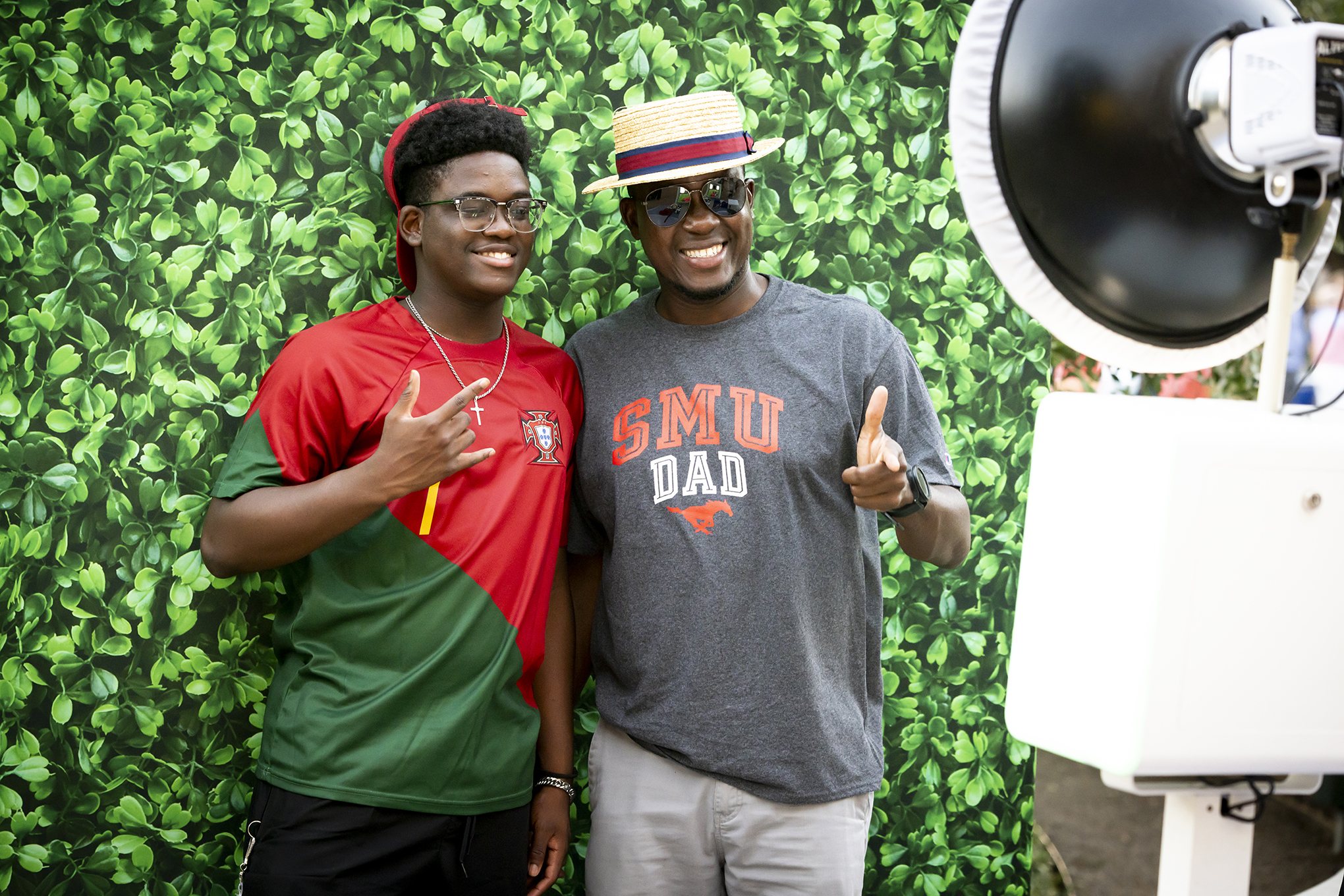 SMU student and SMU dad pose for photo