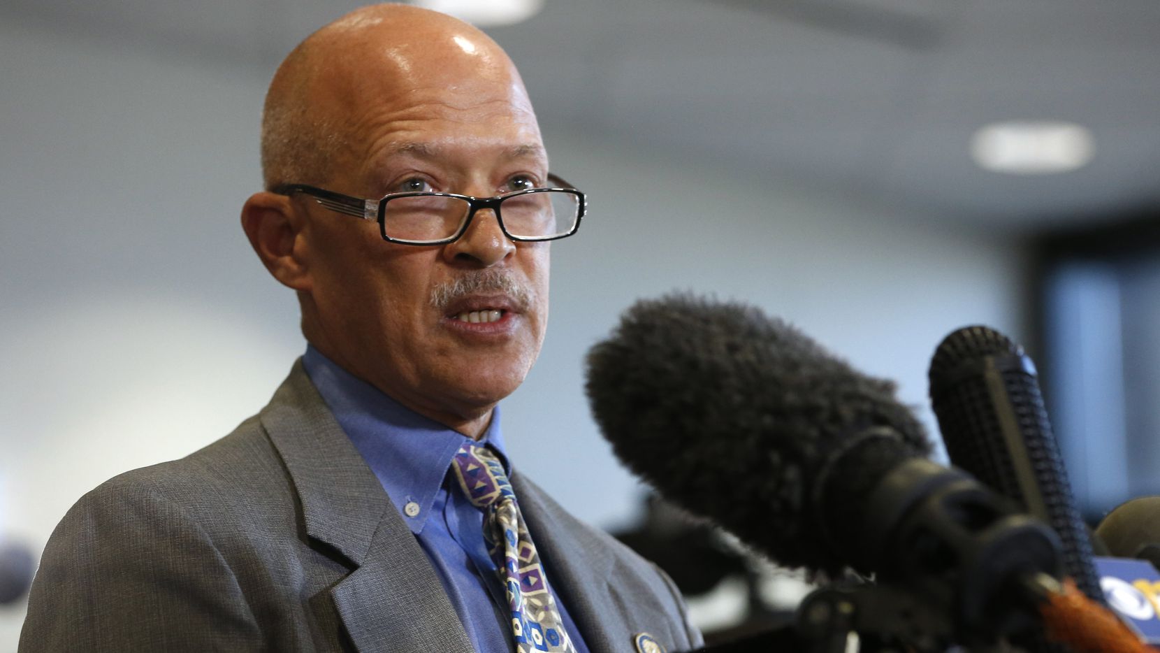 person talking at microphone