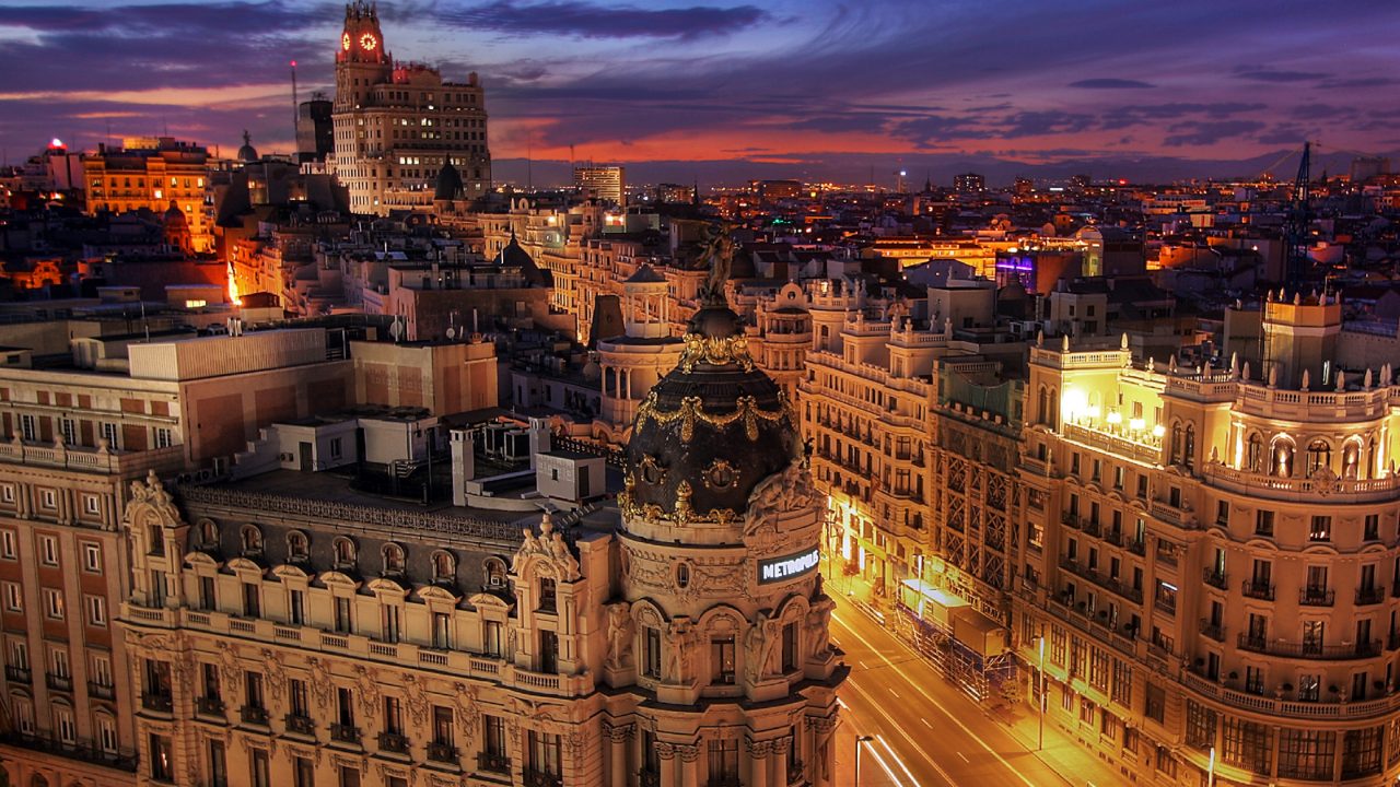 Image of Madrid building and street intersection at night