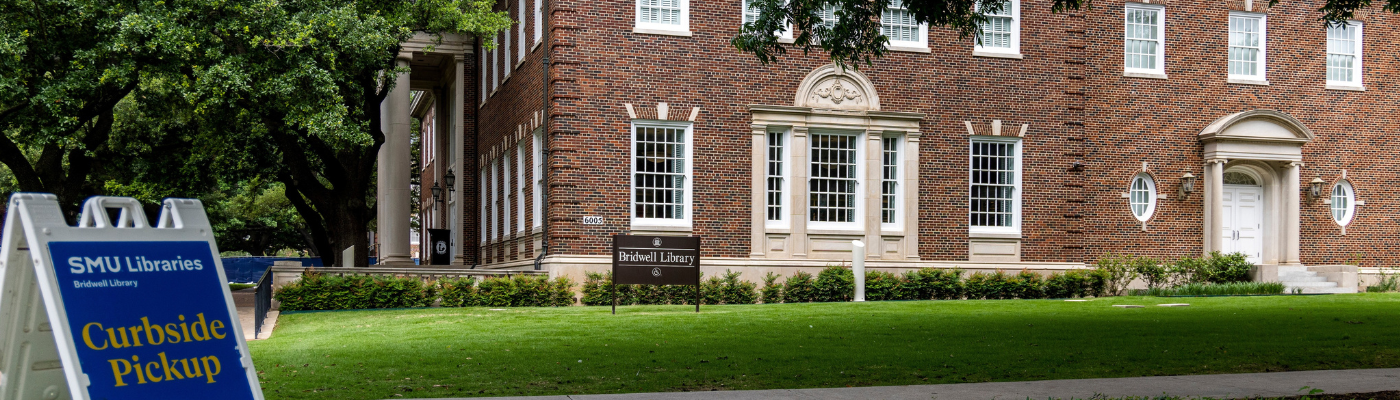 Exterior of Bridwell Library with a curbside pickup sign in the foreground