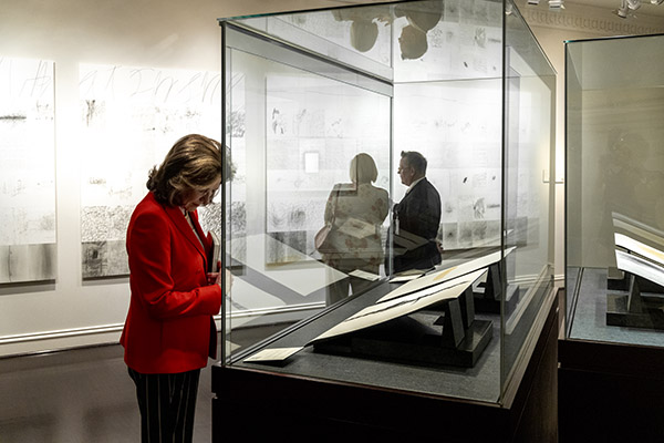visitor viewing special collections items an in exhibit case