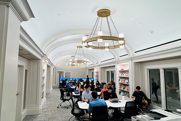 Duda Family Business Library with students studying at tables and computers