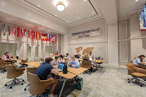 students at tables in the Ida Family Reading Room