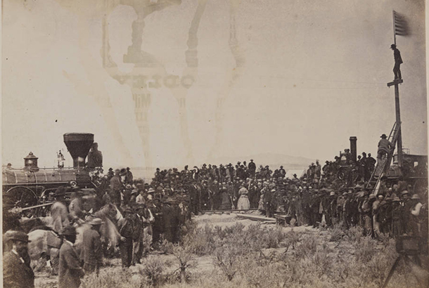 Image of a crowd at the ceremony placing the final rail to mark the completion of the first transcontinental railway at Promontory Point, Utah.