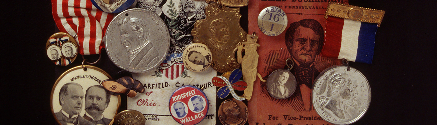 [Assortment of Campaign Memorabilia on Black Background]