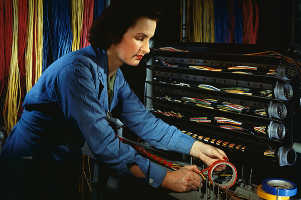 Woman assembling wire, Chrysler