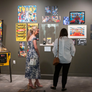Two women looking at art on the walls of the Hawn Gallery