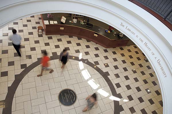people walking in library lobby