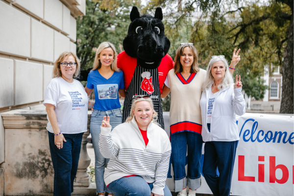 Libraries staff pose with Peruna