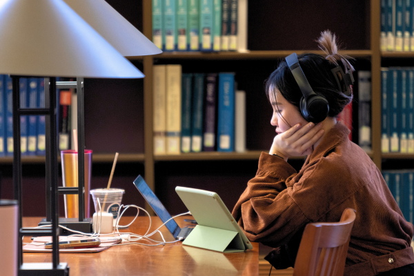 student studies in the Fondren Library reading room