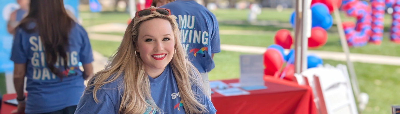 SMU Libraries staff member in a tent on Giving Day