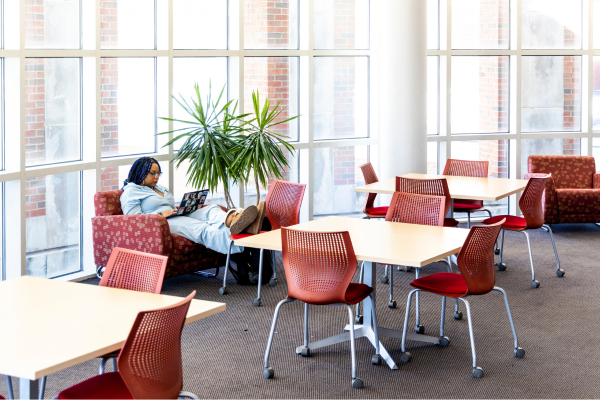 a student studying with her feet up in Hamon Arts Library