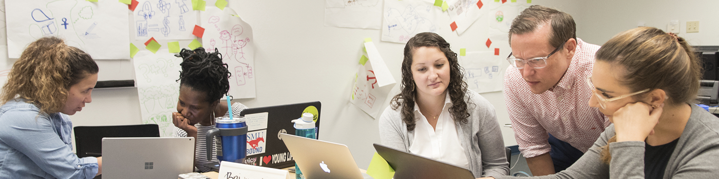 students working on project with an archivist