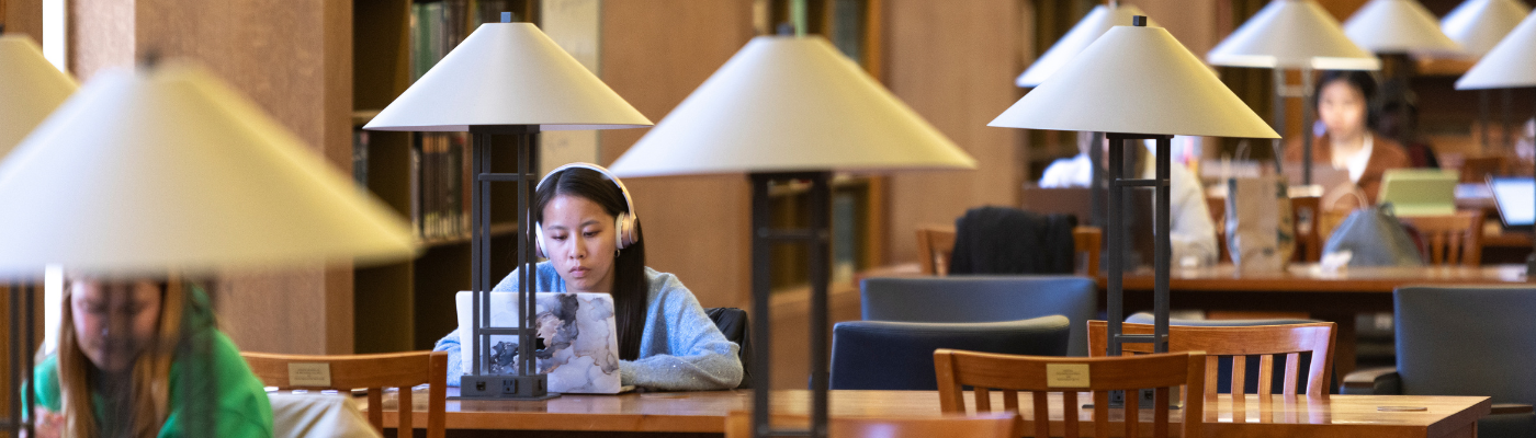 student studying in the Centennial Reading Room in Fondren Library