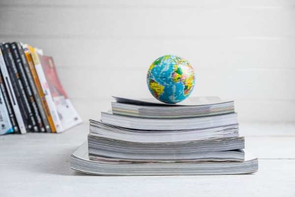 small globe on top of stack of books