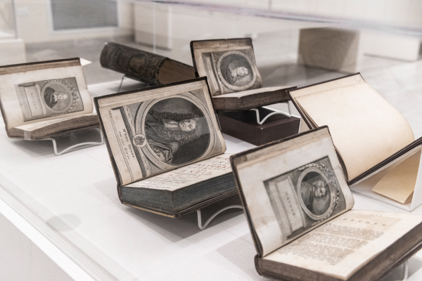 books in a glass exhibit case
