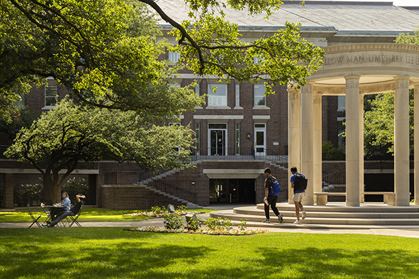 students on lawn in front of Underwood Law Library