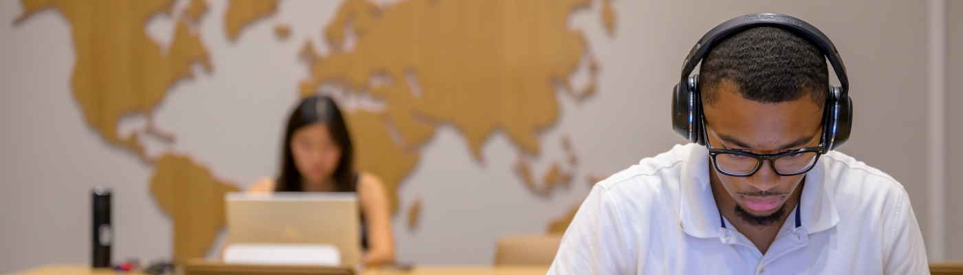 Student studing in the Ida Family Reading Room at the Duda Family Business Library