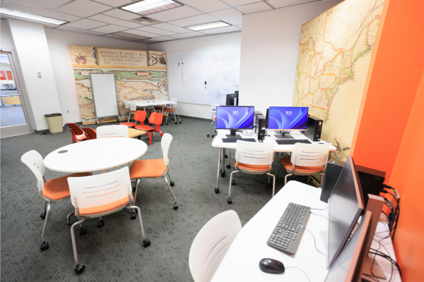 Room with small group and computer tables