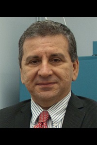 A headshot of Yildirim Hurmuzlu, a member of the Lyle School of Engineering Faculty.