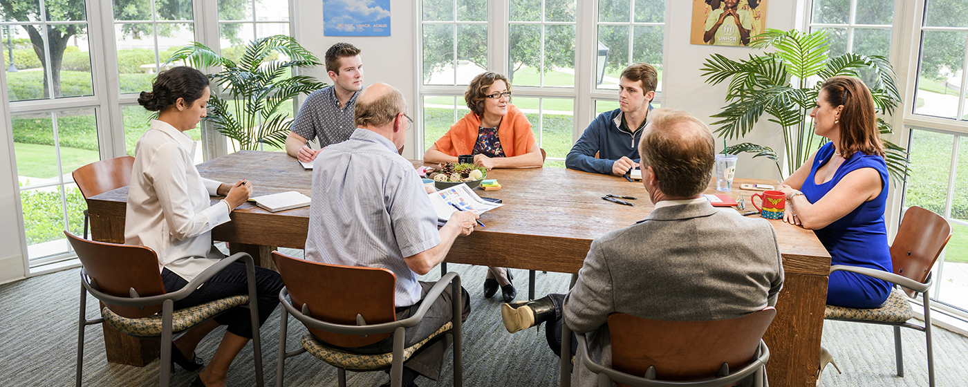 group of people at a long table